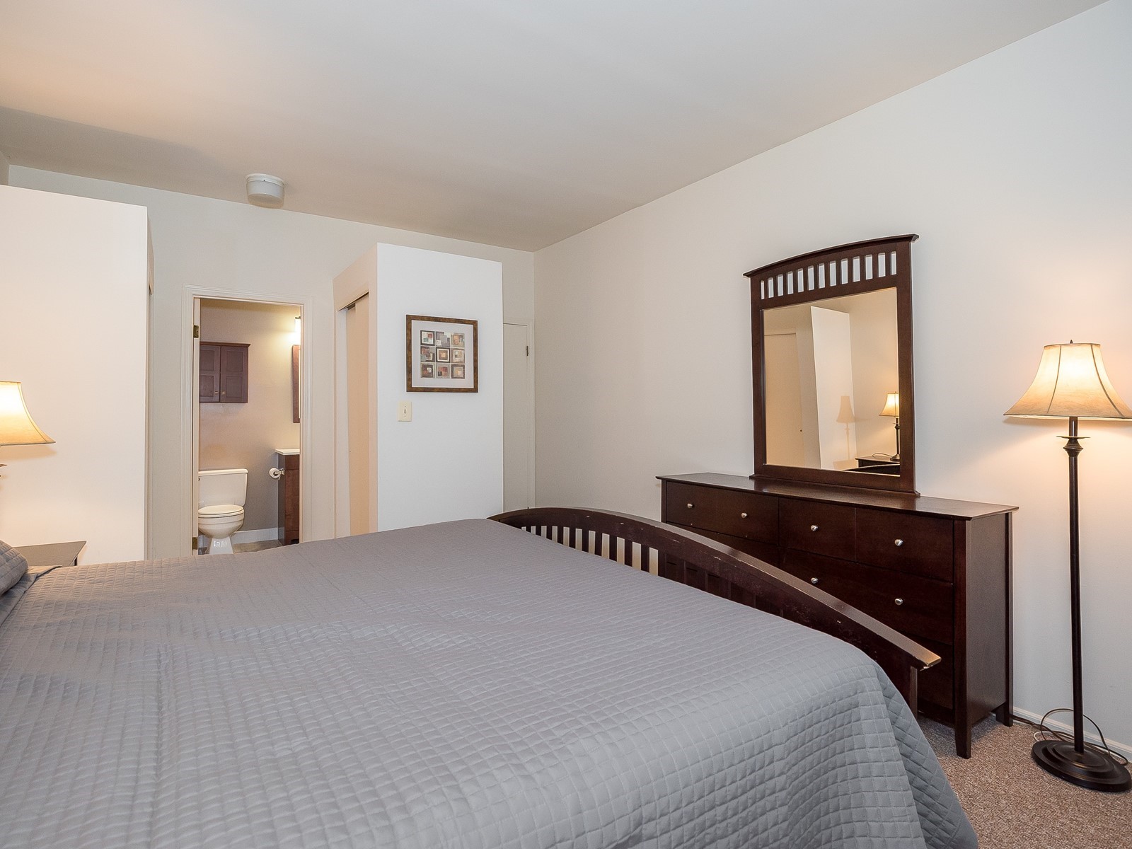 Furnished Apartment South Brunswick 3361 Master bedroom with large bed and large dresser