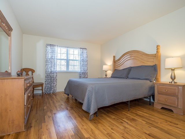 Bridgewater 9 Furnished Housing master bedroom with large bed, dresser and two nightstands